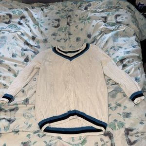 White sweater with blue and black stripes